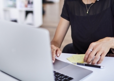 woman working phone laptop